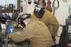 Air Force Staff Sgt. Levi Smelser and Airman 1st Class Taylor Zehr, both 773d Civil Engineer Squadron Airmen, practice welding on scrap metal at the construction shop on Joint Base Elmendorf-