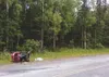 GREG JOHNSON/Frontiersman A four-wheeler remains on a trail
along Lucille Street near Schrock Road Thursday evening following
an accident that injured two teenagers.