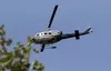 An Alaska Division of Forestry helicopter flies toward a wildfire in this Frontiersman file photo. Frontiersman file photo
