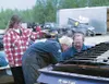 Debbie Bundtrock supervises as son Justin Haxton and husband
Terry Bundtrock work on Bundtrock's car. The entire
Bundtrock-Haxton clan is involved in racing at Capitol Speedway, or
has been i