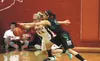 Wasilla's Machia Toews and Colony's Chase Stephens reach for a loose ball during Colony's 38-37 win over the Warriors at Wasilla High Tuesday night. MatSuSports.net