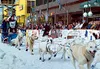 Clockwise from above, Wasilla's Ellen Halverson pulls away from
the starting line in Anchorage Saturday. Halverson is an Iditarod
veteran who is looking to improve again this year. Top right,