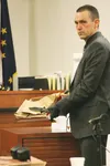 Trooper Investigator Shannon Fore displays the knife used to kill Michael Plummer to jurors during testimony Friday. Jurors also heard testimony from the lead investigator on the case, and vi