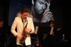 James Nelson plays 'Careless Whisper' by George Michael (pictured in back) on his saxophone during a Wednesday rehearsal of 'The Evolution of Music' at Palmer High. The show opens Friday, Feb