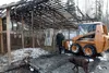 Ronnie Bernier III, and other family members and neighbors have been busy cleaning up what remains of the family's dog kennel. The Berniers operates Alaska Labradors and their kennel burned e