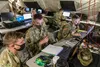 1st Lt. Austin Koontz, intelligence collection platoon leader, left, and Spc. Jeremy Olson, intelligence analyst, right, assigned to D Company, 326th Brigade Engineer Battalion, 1st Brigade C