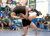 Houston Hawk Ryan Radmer takes Colony's Kamber Lucas to the mat during third-place 152 lb. competition at the Lancer Smith Memorial Saturday Nov. 23, 2013 at Palmer High School. Radmer repeat