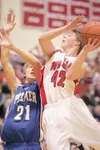ROBERT DeBERRY/Frontiersman Palmer forward Jake Hillis attempts
to stop Wasilla's Jason Flower's drive to the basket during the
second period of Wednesday game at Wasilla High School.