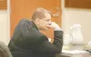 ROBERT DeBERRY/Frontiersman Frank Adams listens to testimony in
Palmer Superior Court last week. Adams is on trial for the beating
death of Stacey Johnston.