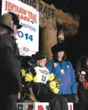 Dallas Seavey and his lead dog, Reef, sit under the famed burled arch in Nome after winning the 2014 Iditarod Trail Sled Dog Race in record time. The win was his second Iditarod victory. He a
