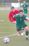 JEREMIAH BARTZ/Frontiersman Colony senior Bridger Van Ness races
toward the ball during a 2-1 loss to Juneau-Douglas.
