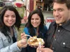 From left, Daniella Rivera, Liz Raines and Adam Nicely prepare to devour a treat from Denali Cream Puffs Thursday at the Alaska State Fair in Palmer. AMY ARMSTRONG/For the Frontiersman