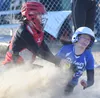 Palmer’s Zoe Patton-Meyer slides under the tag of Kenai Central catcher Kylen Lakshas on Friday, April 26, 2019, at Steve Shearer Memorial Ball Park in Kenai, Alaska. Jeff Helminiak/Peninsula