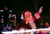 Santa Claus waves to the crowd during a past Colony Christmas Parade of Lights. Frontiersman file photo