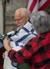 Vietnam Army veteran William Grover receives his Quilt of Valor certificate and his quilt during the ceremony Aug. 12 at K2 Aviation in Talkeetna. J. David McChesney/Frontiersman