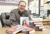 GREG JOHNSON/Frontiersman Fireside Books owner David Cheezem
ordered 100 copies of Sarah Palin'€™s book 'Going Rogue: An
American Life,' which goes on sale today.