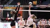 Colony's Cianna Jorgenson goes up for the block as Wasilla's Cheyenne Green hits the ball over the net during a state tournament win over Wasilla. Tim Rockey/Frontiersman