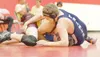 ROBERT DeBERRY/Frontiersman Palmer Moose Sam Heindel wrestles
against Grace Christian Grizzly Thomas Alley during an exhibition
match at Houston High School recently.
