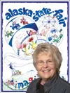 Valley artist Sharon Allen with her 2010 Alaska State Fair
poster.