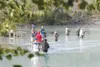 ROBERT DeBERRY/Frontiersman Fishermen and women gather along the
bank of the Knik River at Eklutna Tailrace on Thursday morning. The
Alaska Department of Fish and Game has increased the bag a