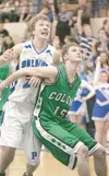 ROBERT DeBERRY/Frontiersman Colony senior Bryce Jacobson boxes
out Palmer’s Jake Hillis during the final minutes of Tuesday’s game
at Palmer High School. The Knights defeated the Moose 40-37.
