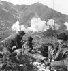 An artillery officer directs United Nations troops as they drop white phosphorus on a communist-held post in February 1951.