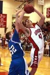 Wasilla's Luke Schafer yanks a rebound in front of Palmer's
Aaron Kohring Friday. Schafer scored 10 points in the game and
Kohring tossed in 12. GENE JANSEN/Frontiersman