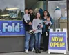 The Chavez family stands outside their new small business, Idita-Wash. Jacob Mann/Frontiersman