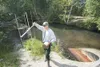 ROBERT DeBERRY/Frontiersman Kevin Foley with the U. S. Fish and
Wildlife Service uses radio telemetry to track sockeye salmon along
the banks of Meadow Creek. Small radio transmitters are ins
