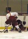 Wasilla's John Schmelz shoots on the Malemute goalie in the
third period of Wednesday's game in Wasilla. Photo by TIM
BRODT/Frontiersman.