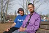 Karl Soderstrom, left, and Kerby Kraus pose for a photo on a bench near Nunley Park in Wasilla — a bench Kraus said was his home when he was addicted to heroin — in the afternoon sun on Wedne