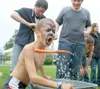 VICKI NAEGELE/For the Frontiersman That’s 10 points.
Nine-year-old Riley Scott of Palmer spews a carrot after retrieving
it with his mouth from a tote full of water at UAF’s Matanuska
Experim