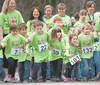 Tanaina Elementary School kindergarteners, first and second graders along with parents and teachers leave the starting line on the final mile of the schools 26-mile marathon. The event was pa
