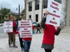 University of Alaska faculty members and supporters march in front of the Alaska State Capitol during a United Academics rally June 22, 2022.  Lisa Phu/Alaska Beacon