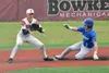 Palmer's Reed Craner slides in safe in front of Kenai Central's Jackson Marion at the third-fifth-place game at the Division II state tournament Saturday, June 1, 2024, at Wasilla High School