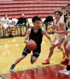 Colony's Jeremiah Hersrud drives the baseline during a win over Wasilla. Courtesy of Bruce Eggleston/matsusports.net