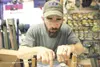 ROBERT DeBERRY/Frontiersman Three Rivers Fly and Tackle pro
staff member Steve Runyan works on a custom fishing rod at the
Wasilla location Thursday afternoon.