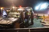 West Lakes rescue personnel remove the roof from a vehicle involved in a three vehicle accident near mile 47 of the Parks Highway Friday evening. The accident which involved two suv type vehi