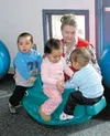 Billie Blanchard plays with children at Chugiak Children's
Services at the Alaska Job Corps Center in Palmer. Submitted
photo.