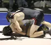 Houston senior Aaron Drake battles South Anchorage's Greg Schack in the 126-pound final of the Lancer Smith Memorial Nov. 22 at Palmer High School. Drake scored an 8-6 overtime win in the mat