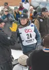 Iditarod rookie Sam Martin high-fives a supporter during the 2026 Iditarod restart in Willow Sunday, March 8, 2026. J. David McChesney/Frontiersman