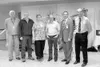 Dr. John Zwiacher, Dr. Garth LeCheminant, Dr. Peggy Downing, Dr.
D. Glen Elrod, Chief Executive Officer Dr. John Lee and Dr. Mike
Fitzgerald stand in front of a robotic surgery device at a
ce