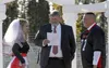 Longtime Houston defensive coordinator Jared Barret, right, married his wife Tami on the Houston High football field Sept. 19, 2015. Barrett's longtime friend and mentor, Norm Bouchard, was t