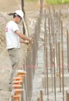 ROBERT DeBERRY/Frontiersman Criterion General Inc. employee Jeff
Swallow works on the rebar for a new sports complex at the
intersection of the Palmer-Wasilla Highway and Double B Street
Thur