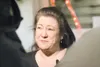 ROBERT DeBERRY/Frontiersman Ronda Marcy, longtime friend and
spokeswoman for assault victim Elann Moren and her family, answers
questions from news media after the arraignment of Christopher 