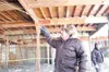 Submitted photo Bob Kountz of the Community Emergency Response
Team points out a simulated weakness in the structure of a
Department of Transportation building in Wasilla last week. Kountz
pa