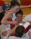 Wasilla senior Chandice Cronk is hoisted on the shoulders of
Warrior fans after hitting the game-winning shot in Wasilla's 47-46
win over top-ranked Lathrop at Wasilla High on Friday. Photo b
