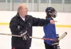 ROBERT DeBERRY/Frontiersman Houston High head coach hockey Mike
Styers works with the team during practice Monday at the Curtis D.
Menard II Memorial Ice Arena in Wasilla.