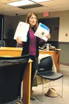 Susanne DiPietro, executive director of the Alaska Judicial Council (AJC), was one of several presenters at the Tuesday evening meeting of the Mat-Su Opioid Task Force. Above, she holds up th