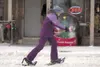 ROBERT DeBERRY/Frontiersman Jillian Donelson, 12, leaves her
ornament behind as she scrambles along the snowshoe obstacle course
Saturday in downtown Palmer during the 2011 Colony Christmas
c